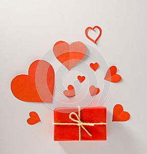 Valentine's Day background. Gifts, candle, confetti, envelope on pastel white background. Valentines day concept.