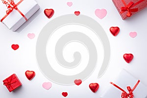 Valentine`s Day background. .with gifts and hearts, in red and white, top view. San valentin and love concept
