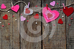 Valentine`s Day background with handmade felt hearts, clothespins. Valentine gift making, diy hobby. Romantic, love concept. Happ