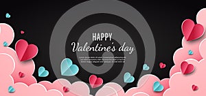 Valentine`s day background. Hearts pink and blue papaer cut card on black background. Decor clouds space for text