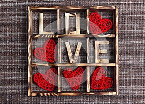 Valentine`s day background with love and hearts in the wooden box on sackcloth