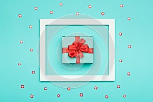 Valentine`s Day Background. Pastel Blue Candy Colour flat lay minimal concept with beautifully wrapped present.