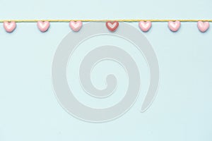 Valentine`s Day background. Pink hearts on pastel blue background. Valentines day concept. Flat lay, top view, copy space