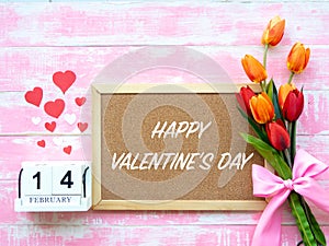 Valentine`s Day Background. Red Heart, 14 February wooden calendar, Flower on Wooden background