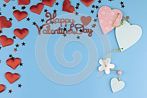 Valentine\'s day background. Red hearts on a pastel blue background  copy space. Flat lay  top view