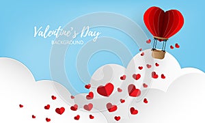 Valentine`s Day background with red paper hearts falling from hot air balloon on blue sky and white clouds background.