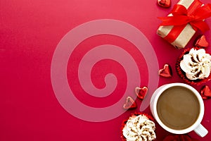 Valentine's day background, red roses, coffee cup, cupcakes, gift box and hearts on red background with copy space