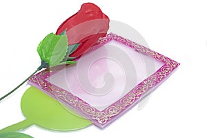Valentine\'s Day background. red roses with a photo frame on white