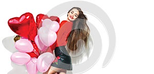 Valentine`s Day. Beauty girl with colorful air balloons having fun