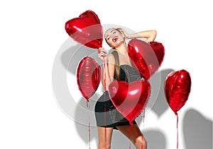 Valentine`s Day. Beauty girl with colorful air balloons having fun, isolated on white