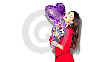 Valentine`s Day. Beauty girl with colorful bouquet of flowers and heart shape air balloon on white background