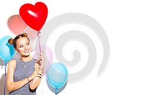 Valentine`s Day. Beauty girl with red heart shaped air balloon laughing over white background