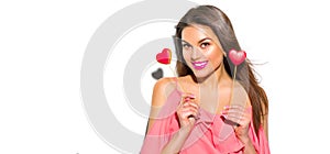 Valentine`s Day. Beauty joyful young fashion model girl with Valentine heart shaped cookies