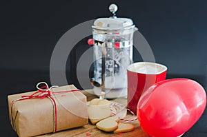 Valentine`s Day, biscuits and heart-shaped balloon, coffee cup a