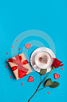 Valentine's Day breakfast Gift, coffee rose, hearts on blue background. Valentines day concept. Flat lay, top view