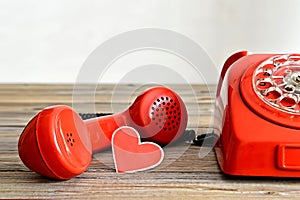 Valentine's Day card: Old red telephone and heart shaped tag