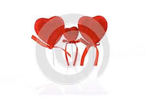 Valentine`s Day. Card, three red hearts family, isolated on a white background with reflection.