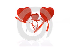 Valentine`s Day. Card, three red hearts family, isolated on a white background with reflection