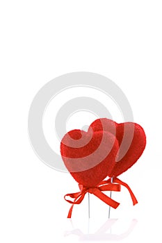 Valentine`s Day. Card, two red hearts isolated on a white background with reflection.