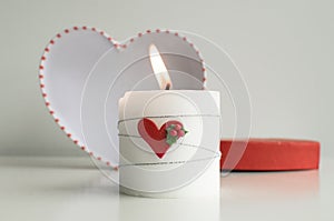 ValentineÂ´s Day Composition with Candle and Eiffel Tower Souvenir
