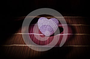 Valentine's Day composition with sweet burning multicolored heart on dark background, selective focus, or love greeting card of he