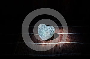 Valentine's Day composition with sweet burning multicolored heart on dark background, selective focus, or love greeting card of he