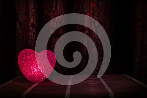 Valentine's Day composition with sweet burning multicolored heart on dark background, selective focus, or love greeting card of he