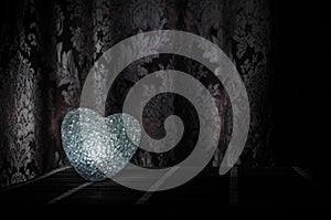 Valentine's Day composition with sweet burning multicolored heart on dark background, selective focus, or love greeting card of he