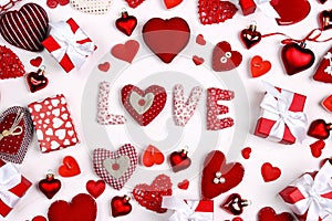 Valentine`s day composition with word love, many different hearts and gifts on white background