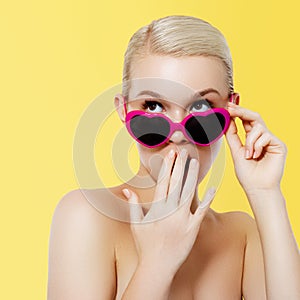 Valentine& x27;s Day concept. 14 february. Fashion Model girl isolated over yellow background. Beauty stylish
