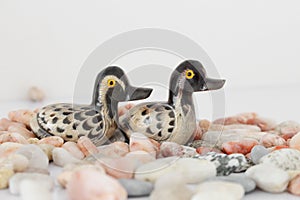 Valentine`s day concept. Couple in love, just married or honeymoon concept. Couple of stone mandarin ducks toy.
