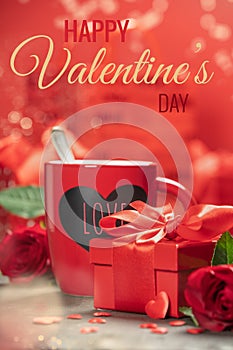 Valentine's Day concept with fresh cup of coffee, red roses, chocolate and gifts