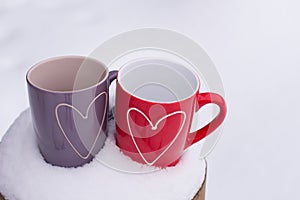 Valentine`s day concept with hearts and cups over nature