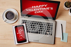 Valentine`s day concept on laptop and smartphone screen