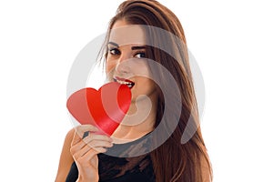 Valentine`s day concept. Love . portrait of Young beautiful girl with red heart isolated on white background in studio