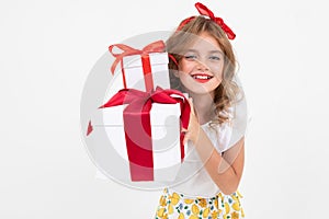 Valentine`s day concept. portraits a beautiful attractive girl holding a gift she has just received on a white