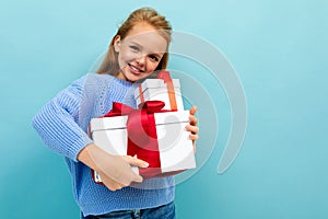 Valentine`s day concept. smiling girl with gifts with copy space