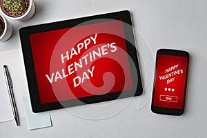 Valentine`s day concept on tablet and smartphone screen