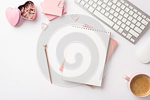 Valentine`s Day concept. Top view photo of workspace planners pen keyboard pink sticky note paper heart shaped clips holder and