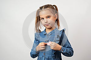 Valentine's day. Cute little child girl holding red heart