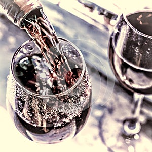 Valentine`s day, date, love, Celebration. pouring red wine. Wine in a glass, selective focus, motion blur, Red wine in a glass. S