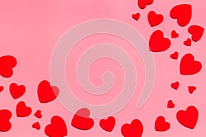 Valentine`s Day design. Red hearts frame on pink background top-down copy space