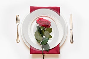 Valentine`s day dinner. Romantic table setting with red rose. View from above