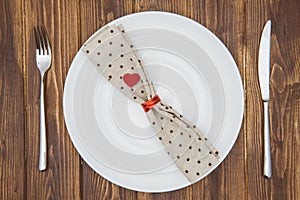 Valentine's day dinner setting, Knife, fork, napkin and plate