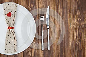Valentine's day dinner setting, Knife, fork, napkin and plate