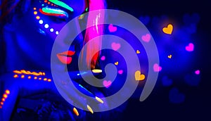 Valentine`s day disco party. Fashion model girl in neon light