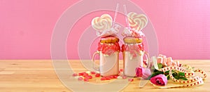 Valentine`s Day freak shakes with heart shaped lollipops and donuts.