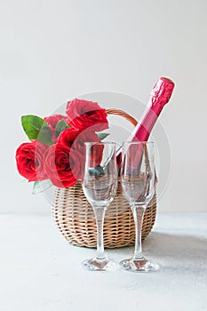 Valentine`s day gift hamper, bouquet of red roses, champagnes on white