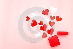 Valentine's Day. Gifts, hearts on rose background. Concept of love and affection. Holiday card.