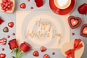 Valentine`s day greeting card with coffee cup, heart shape chocolate, candles and gift boxes